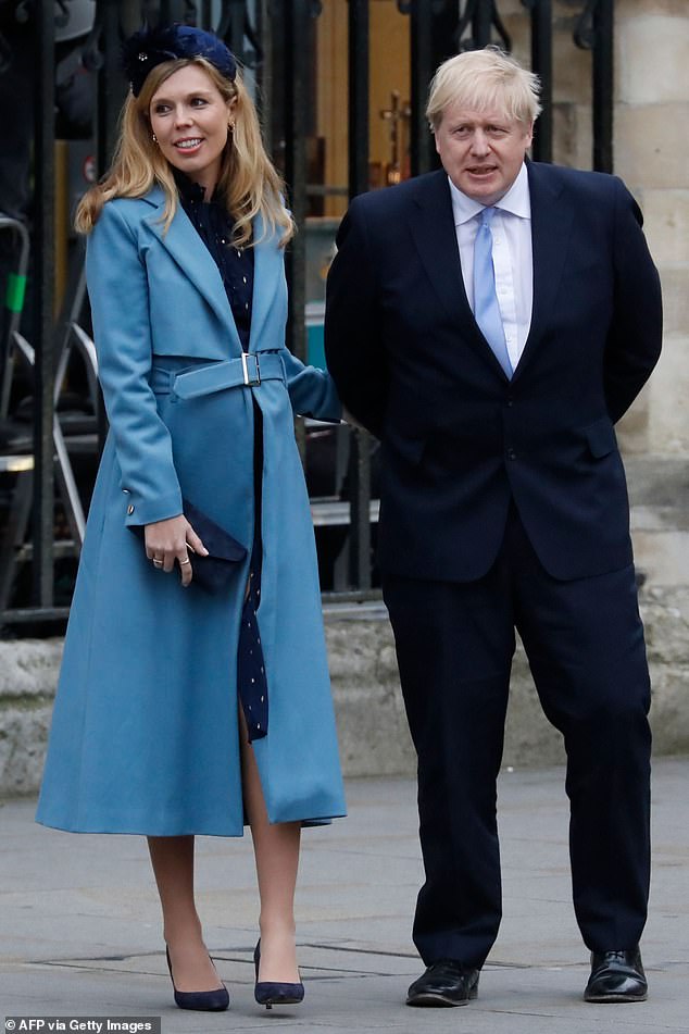 Boris Johnson with his partner Carrie Symonds leave after attending the annual Commonwealth Service at Westminster Abbey in London last month