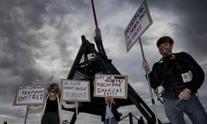 People in Prague hold placards during a protest against the response of the Czech government to the Covid-19 pandemic.