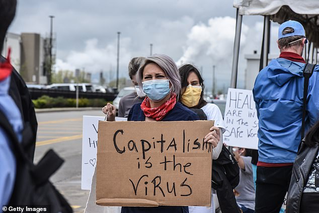 Protesters outside Amazin's fulfillment centerin Staten Island, New York are pictured Friday