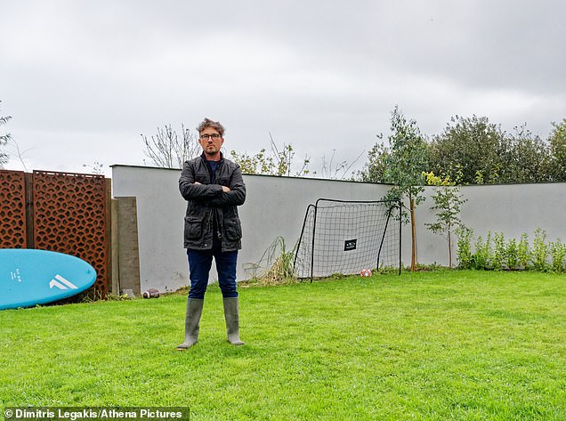 Pictured: Harry Dent in his back garden, behind which the 5G mast will be erected